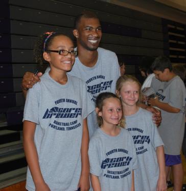 Dallas Basketball Player Corey Brewer with fans. 
