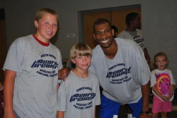 Dallas Basketball Player Corey Brewer with fans. 